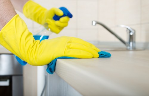 Cleaner working on glass for a W1T office or commercial building